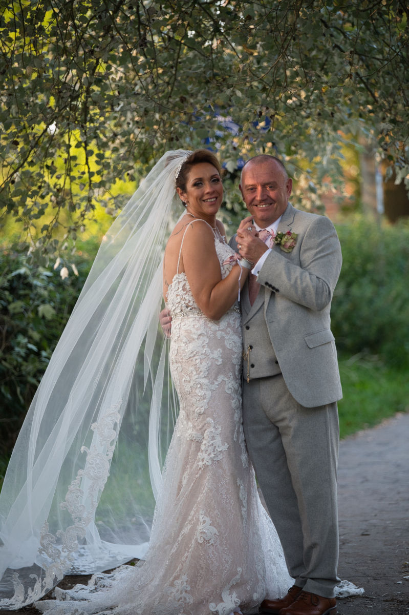 Bride and groom laughing during micro wedding ceremony