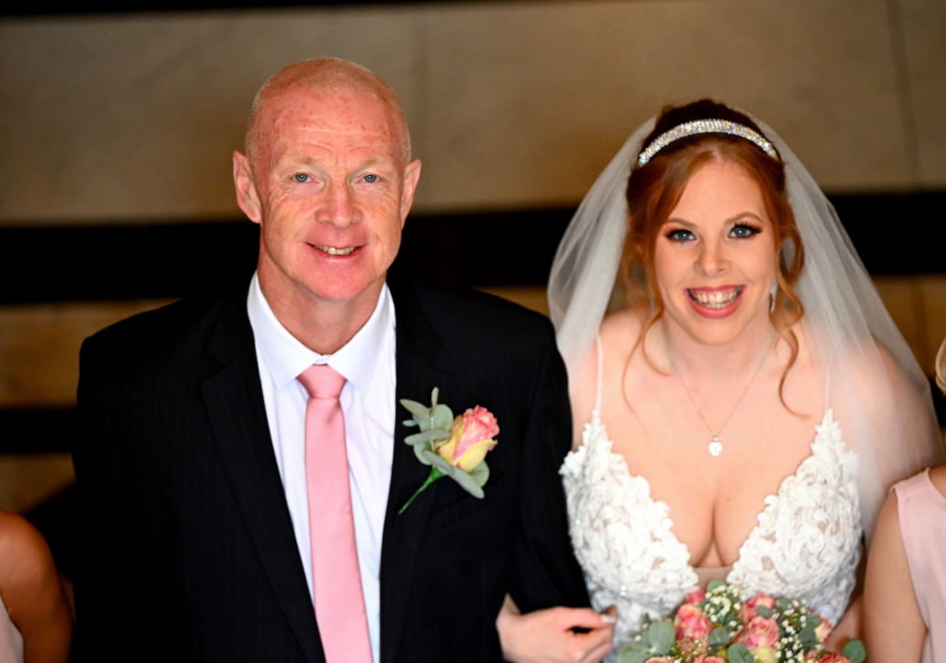 Natural candid moments of the father and is Daughter during small wedding ceremony in Stockport 